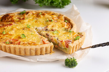 Freshly baked quiche with salmon and broccoli