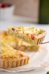 Freshly baked quiche with salmon and broccoli