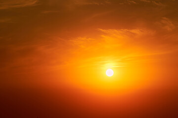 A big red sun in the sunset sky, a summer landscape. Evening sky in hot sunlight