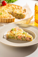 Dinner with fresh homemade pie with salmon fish and broccoli, quiche