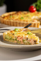 Dinner with fresh homemade pie with salmon fish and broccoli, quiche