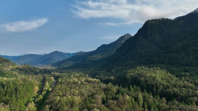 Aerial view of the green forest-filled valleys of the Cascade Mountains near Baring, WA.