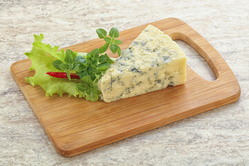 Blue cheese piece over board