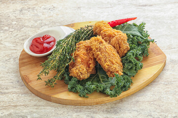 Crispy chicken wings with tomato ketchup