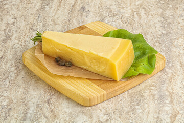 Traditional delicous Parmesan cheese over borad