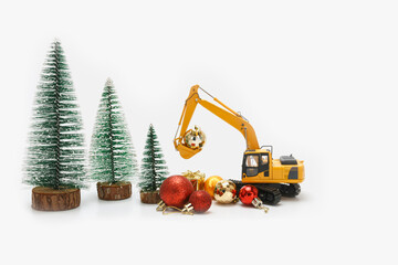 Excavator crawler used bucket lift up christmas ornament , Holiday celebration concept new year on...