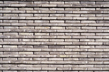 Close-up of ochre brick wall at City of Basel on a sunny summer day. Photo taken August 24th, 2022, Basel, Switzerland.