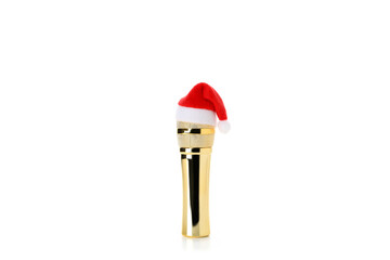 Microphone with Santa hat isolated on white background