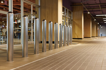 steel bollards in front  underground entrance of the building.