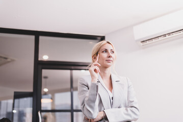 Woman boss in casual suit cross arms and thinking for new idea at modern office
