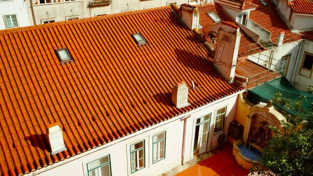 Detailed view of the traditional houses in Alfama, in the oldest district of Lisbon, Portugal, with river Tagus in the background