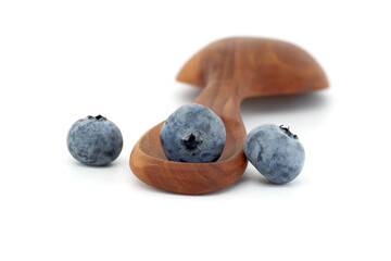 Ripe blueberries over white background