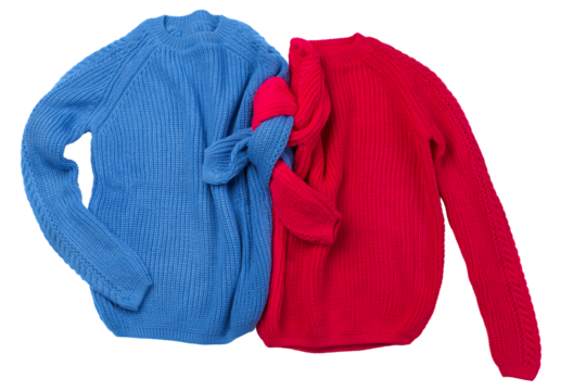 Two sweaters, blue and red, one near the other, like a pair, with tied sleeves, isolate, concept