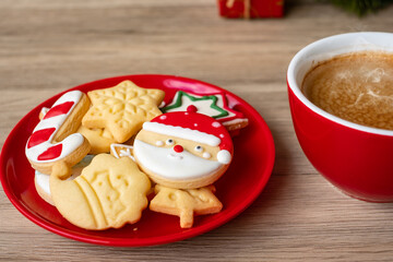 Merry Christmas with homemade cookies and coffee cup on wood table background. Xmas eve, party, holiday and happy New Year concept