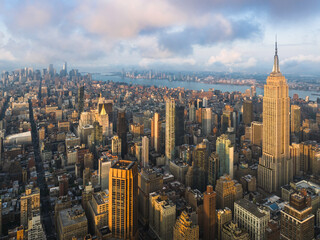 Manhattan skyscrapers at sunrise. Panoramic skyline view of New York City towards lower Manhattan