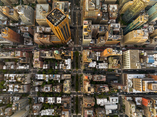 Aerial top down view of New York Manhattan buildings and street intersections. Manhattan cityscape infrastructure with yellow cabs