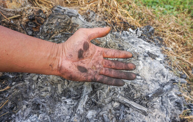 black soiled hands Dirty hands from the farming of the white garden