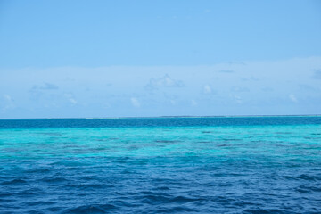 Fototapeta premium Beautiful gradient colour of seawater at Baa atoll, Maldives, during hot afternoon.