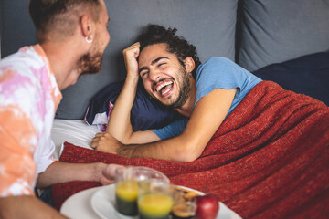 happy gay couple breakfast morning at bed, two young married man at home, lgbt people