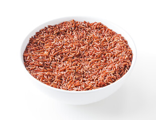 Uncooked red rice in white bowl isolated on white background with clipping path