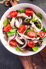 chicken breast salad tomato, green lettuce, onion healthy meal food snack on the table copy space food background 