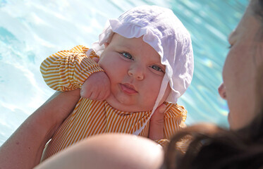 Mother carrying a baby girl