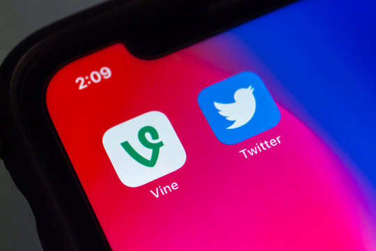 Vancouver, CANADA - Nov 4 2022 : Conceptual image of Vine, an US short-form video hosting service (as of 2022 service is officially discontinued), and Twitter icons on an iPhone.