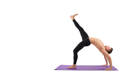 Naklejka premium Sports and healthy lifestyle. A young athletic man is doing Pilates. White background.