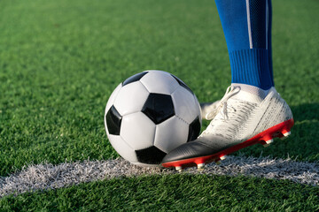 football player set ball football on grass at freekick point before shoot or kick to win a score in...