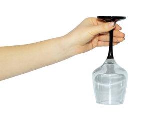 inverted empty wine glass in hand, concept to pass or throw away