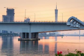 Naklejka premium Skyline, bridge and river landscape of modern urban architecture in guangzhou, china