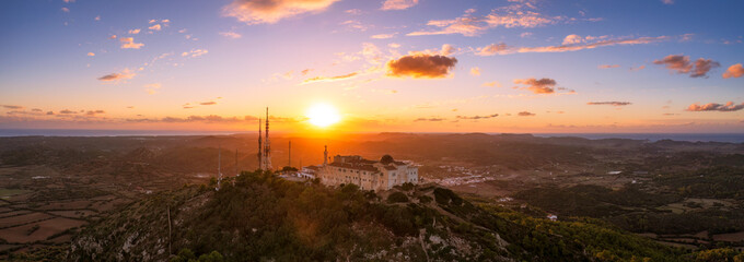 Spain, Balearic Islands, Menorca, Aerial panorama of Sanctuary of Verge del Toro at sunset