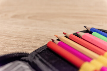 colored pencils in a pencil box