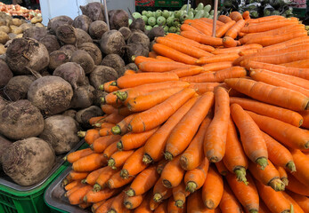Fresh vegetables, carrot on shelves in supermarket
