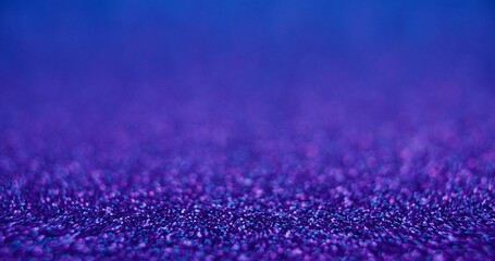 Bokeh light background. Product placement. Bubbles texture. Defocused neon purple blue color...