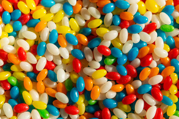 The texture of multi-colored glossy candies, similar to sea pebbles