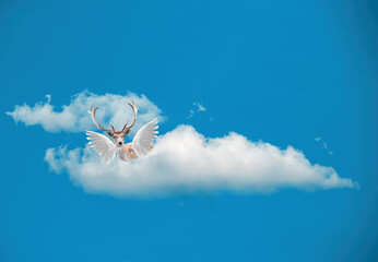 photomontage, a winged deer in the clouds
