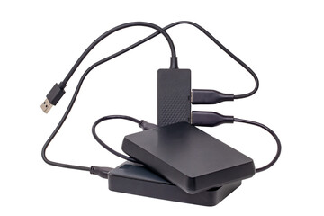 Two large capacity external hard drives connected via USB cable to a 4-port USB distributor isolated on white background. Clipping path. Connect to laptop for backing up files