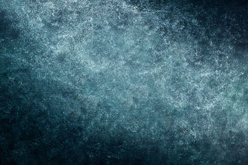 Dark wall with rustic texture illuminated by light. Abstract background.