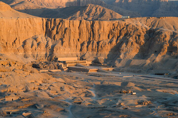 Aerial view of Hatshepsut Temple at sunrise in Valley of the Kings and red cliffs western bank of...