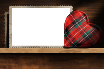 Closeup of empty old vintage photo frames (transparent or white background) and a fabric heart shape on a wooden shelf. Photography, png.