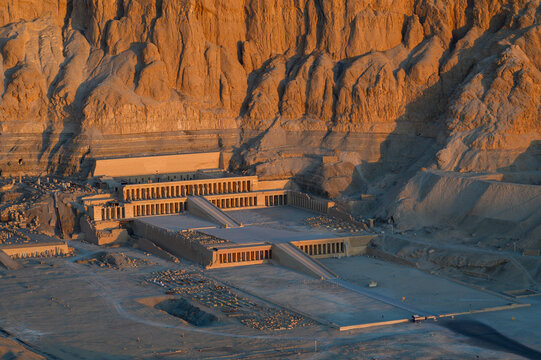 Aerial view of Hatshepsut Temple at sunrise in Valley of the Kings and red cliffs western bank of Nile river- Luxor- Egypt