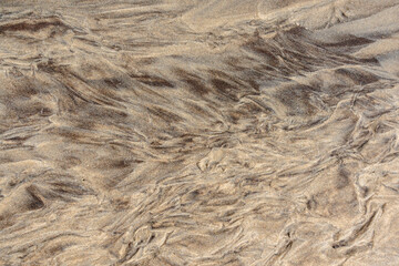 Muster im Sand als Hintergrund