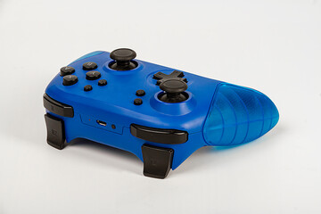 Blue game controller for playstation on a white background. - Powered by Adobe