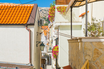 Old romantic street and stairs in historic town of Baska on Krk island in Croatia