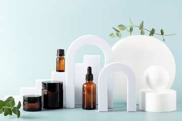 Various blank cosmetic container mock-ups on podiums and geometrical forms. Background for branding...