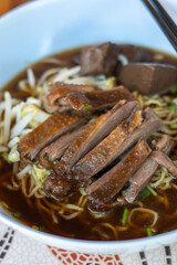 egg noodles with stewed and braised duck in brown soup - Asian food style