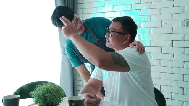 POV shot, hand touching his GAY lover with love and care, LGBTQ men happy cudding embracing each other while having breakfast together, homosexual relationship couple in romantic moment at home
