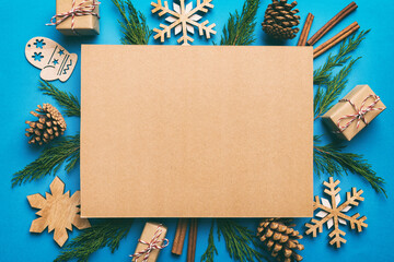 Flat lay Christmas composition. square Paper blank, pine tree branches, christmas decorations on...