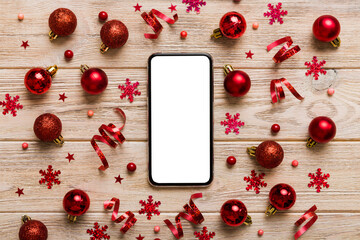 Christmas online shopping from home phone with blank white display top view. smart mobile with copy...